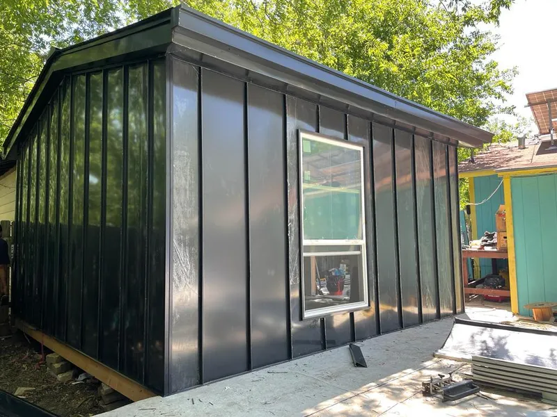 Black standing seam metal wall panels for Roof Inspection in Hingham